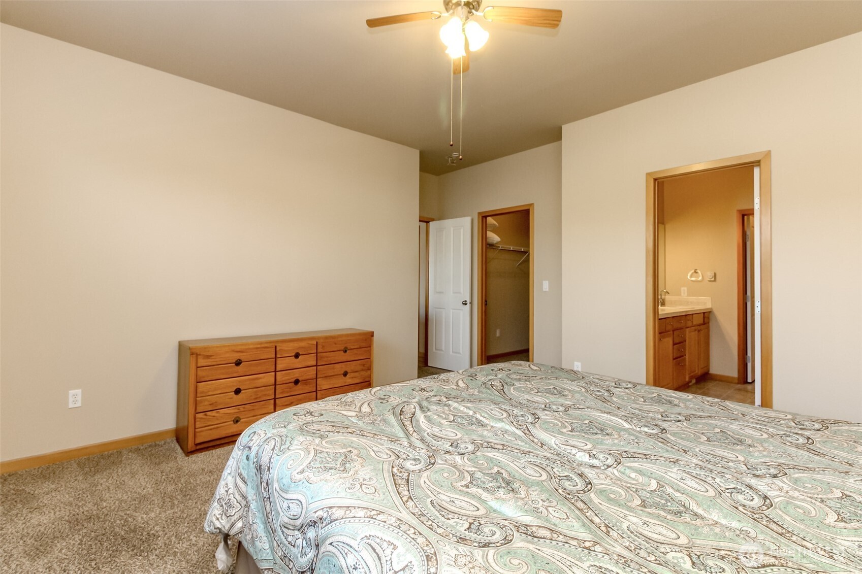 1113 O'Farrell Lane Northwest Orting, WA 98360 - Photo 23 of 36 a bedroom with a bed and a dresser