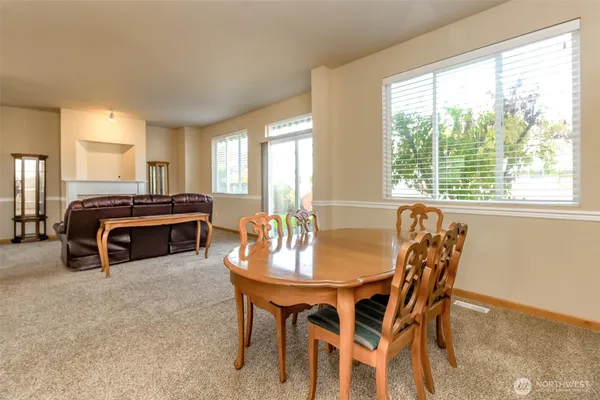 a kitchen with a table and chairs in it