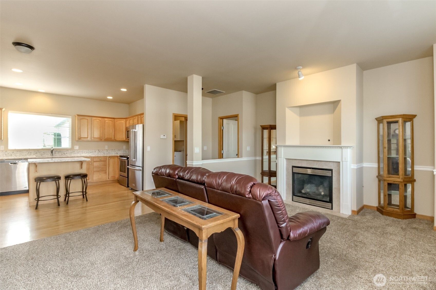1113 O'Farrell Lane Northwest Orting, WA 98360 - Photo 10 of 36 a living room with furniture and a fireplace