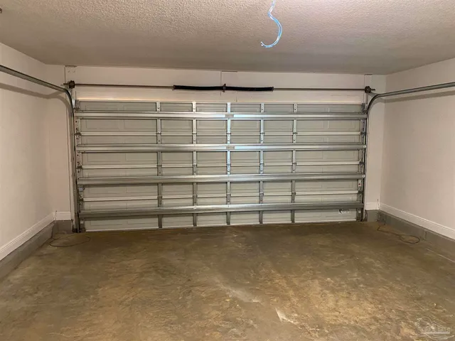 a view of a room with shelf on the wall