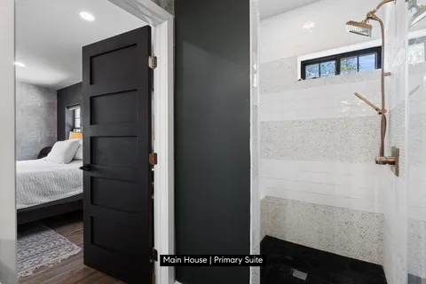 a bedroom with a bed and a walk in closet