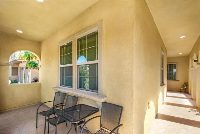 a view of a livingroom with furniture and a window