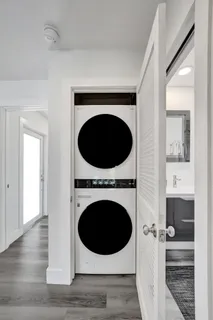 a view of a hallway with washer and dryer
