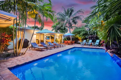 a view of swimming pool with chairs