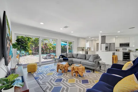 a living room with furniture and a large window