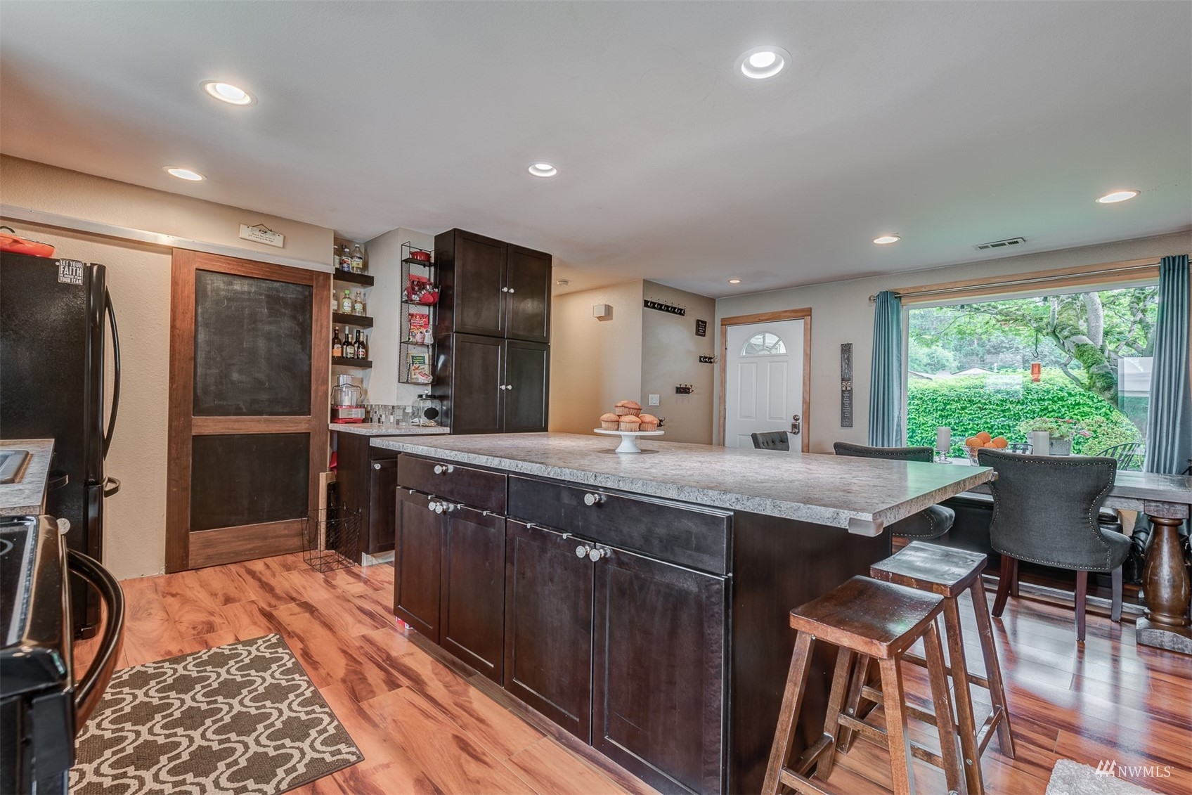 1825 225th Street Southeast Bothell, WA 98021 - Photo 11 of 30 a kitchen with stainless steel appliances granite countertop a sink and a refrigerator