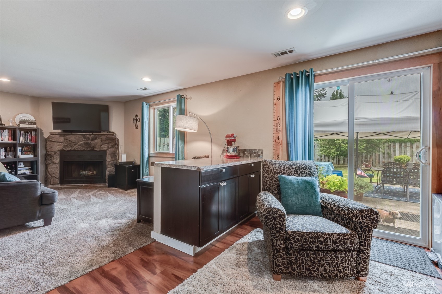 1825 225th Street Southeast Bothell, WA 98021 - Photo 16 of 30 a living room with furniture and a fireplace