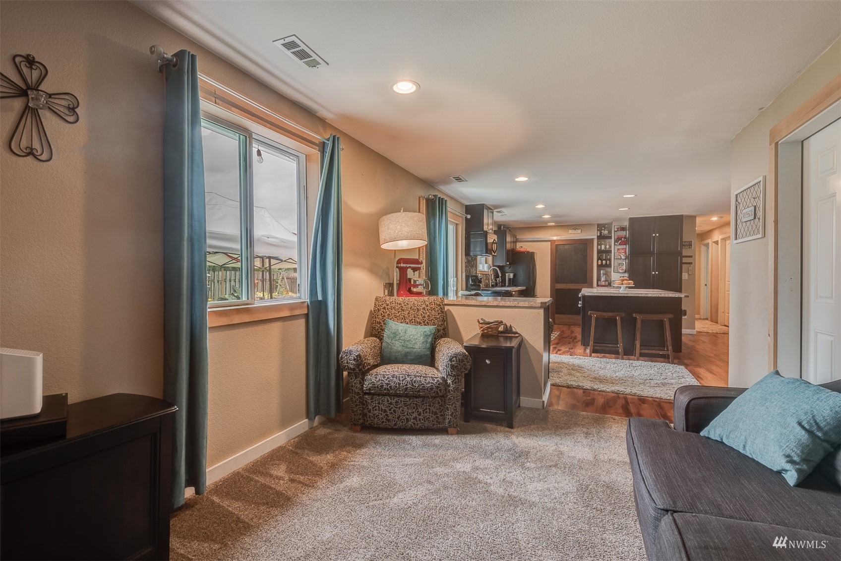1825 225th Street Southeast Bothell, WA 98021 - Photo 18 of 30 a living room with furniture and a window