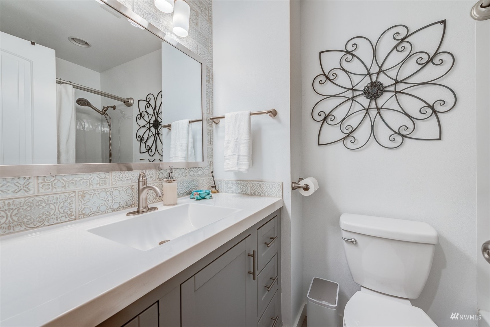 1825 225th Street Southeast Bothell, WA 98021 - Photo 19 of 30 a bathroom with a toilet sink and mirror