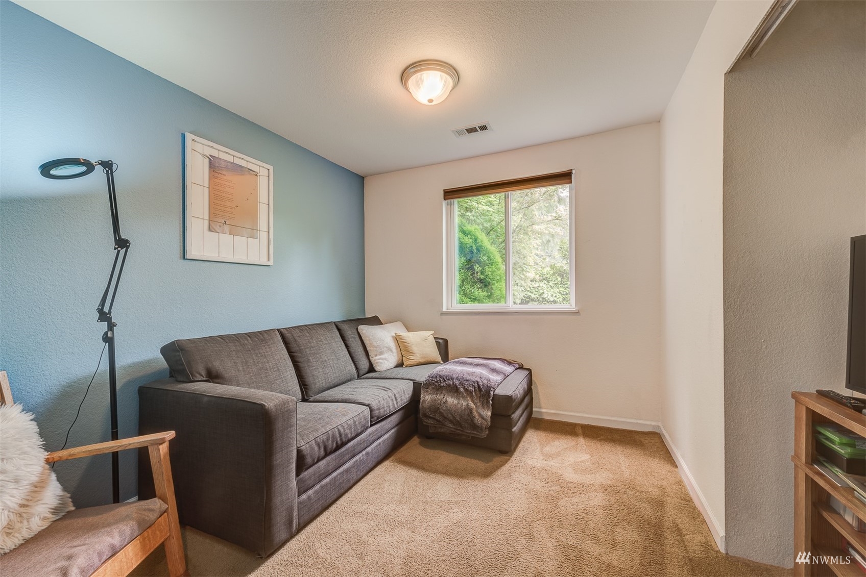 1825 225th Street Southeast Bothell, WA 98021 - Photo 20 of 30 a living room with furniture and a window