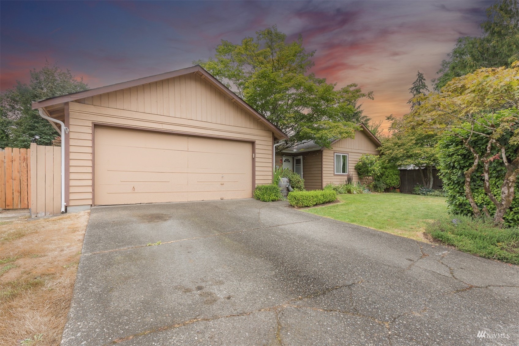 1825 225th Street Southeast Bothell, WA 98021 - Photo 2 of 30 a view of a house with a yard and garage