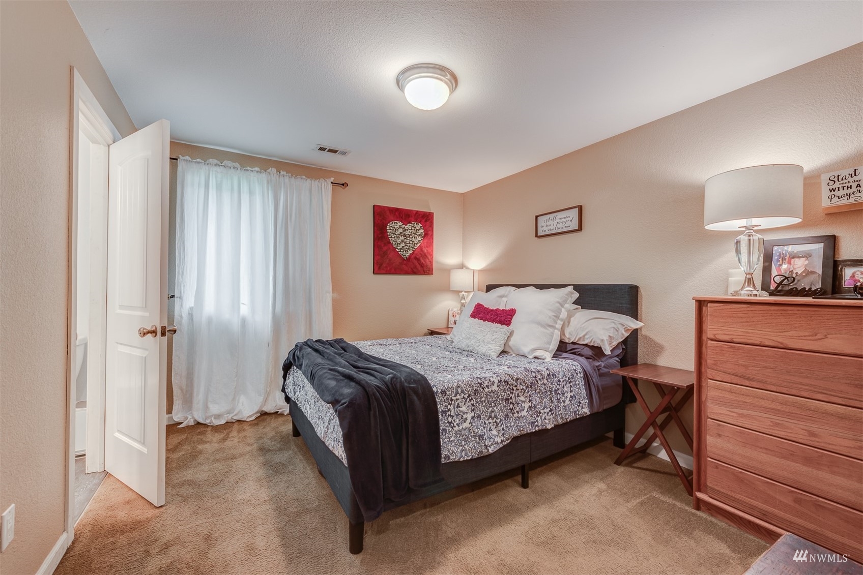 1825 225th Street Southeast Bothell, WA 98021 - Photo 21 of 30 a bedroom with a bed and a lamp