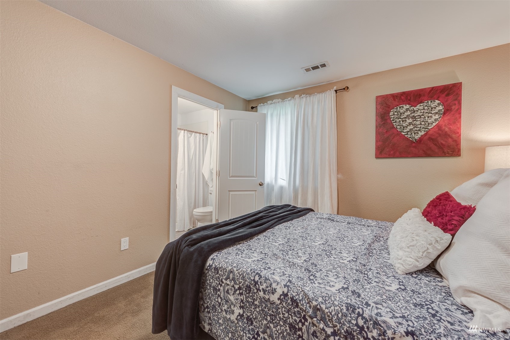 1825 225th Street Southeast Bothell, WA 98021 - Photo 22 of 30 a bedroom with a bed and a painting on the wall