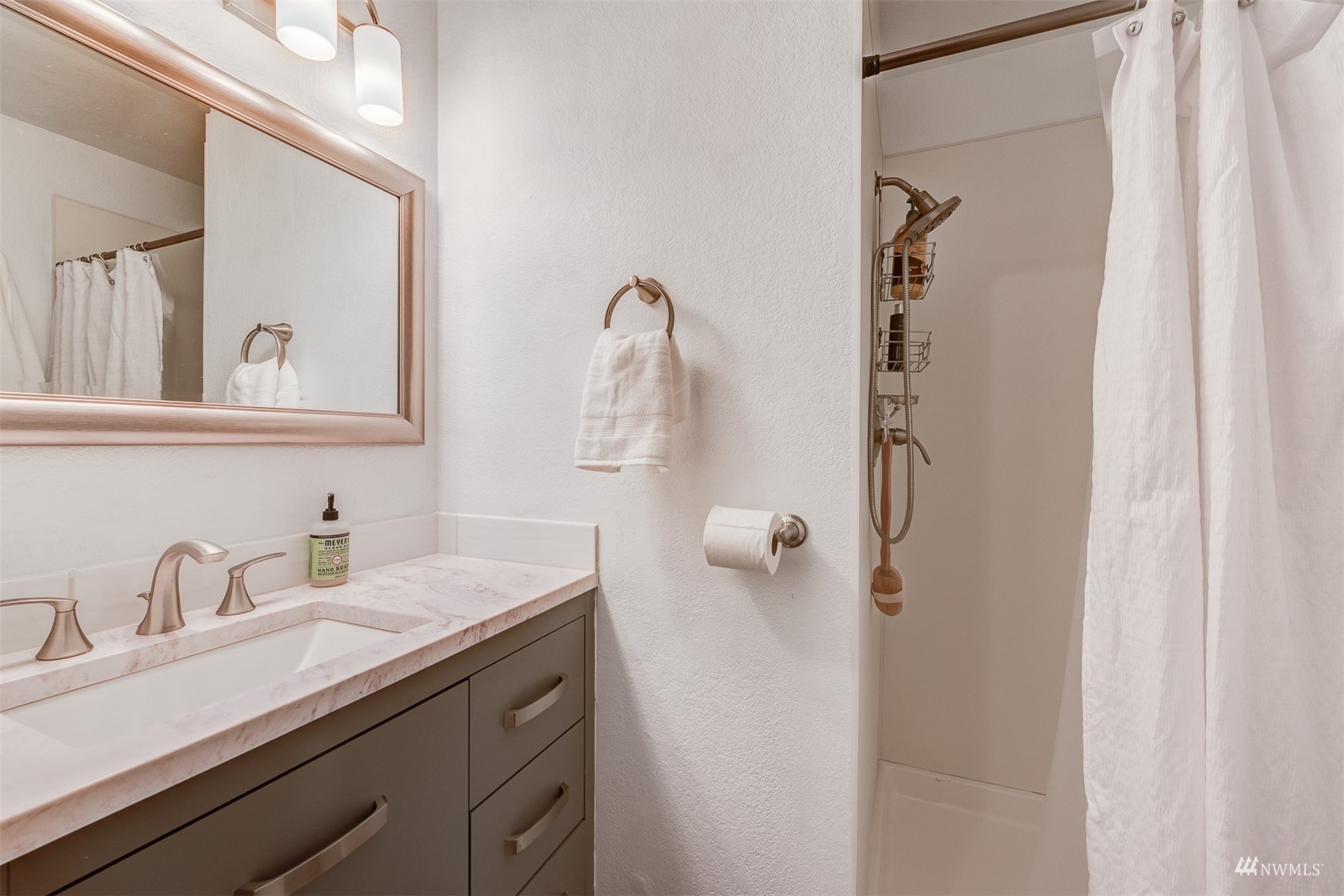 1825 225th Street Southeast Bothell, WA 98021 - Photo 24 of 30 a bathroom with a sink and mirror