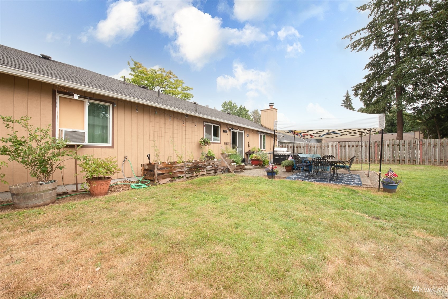 1825 225th Street Southeast Bothell, WA 98021 - Photo 26 of 30 a view of a house with backyard and sitting area
