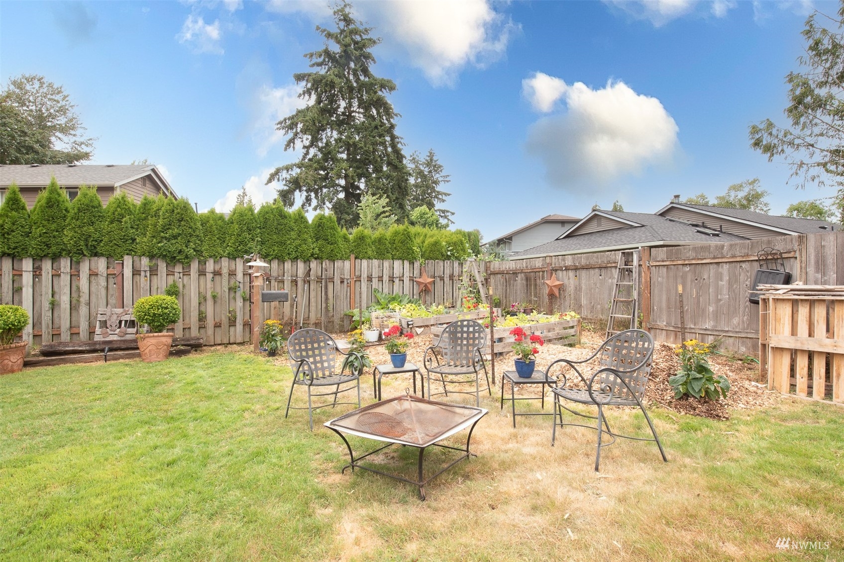 1825 225th Street Southeast Bothell, WA 98021 - Photo 27 of 30 a view of a chairs and table in backyard