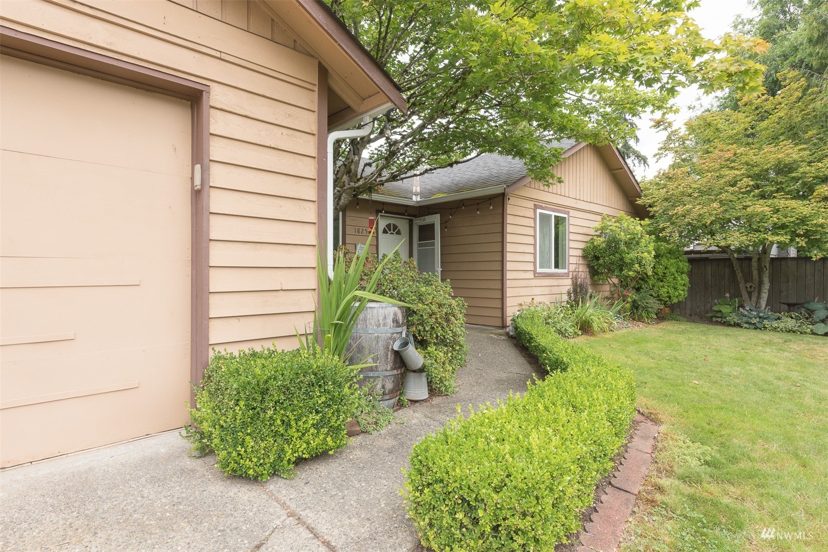 1825 225th Street Southeast Bothell, WA 98021 - Photo 4 of 30 a front view of a house with garden