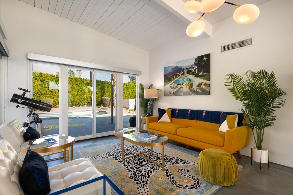 302 East Racquet Club Road Palm Springs, CA 92262 - Photo 11 of 38 a bedroom with furniture and a large window