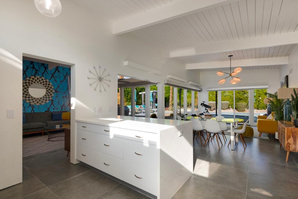 302 East Racquet Club Road Palm Springs, CA 92262 - Photo 15 of 38 a view of a dining room with furniture window and outside view