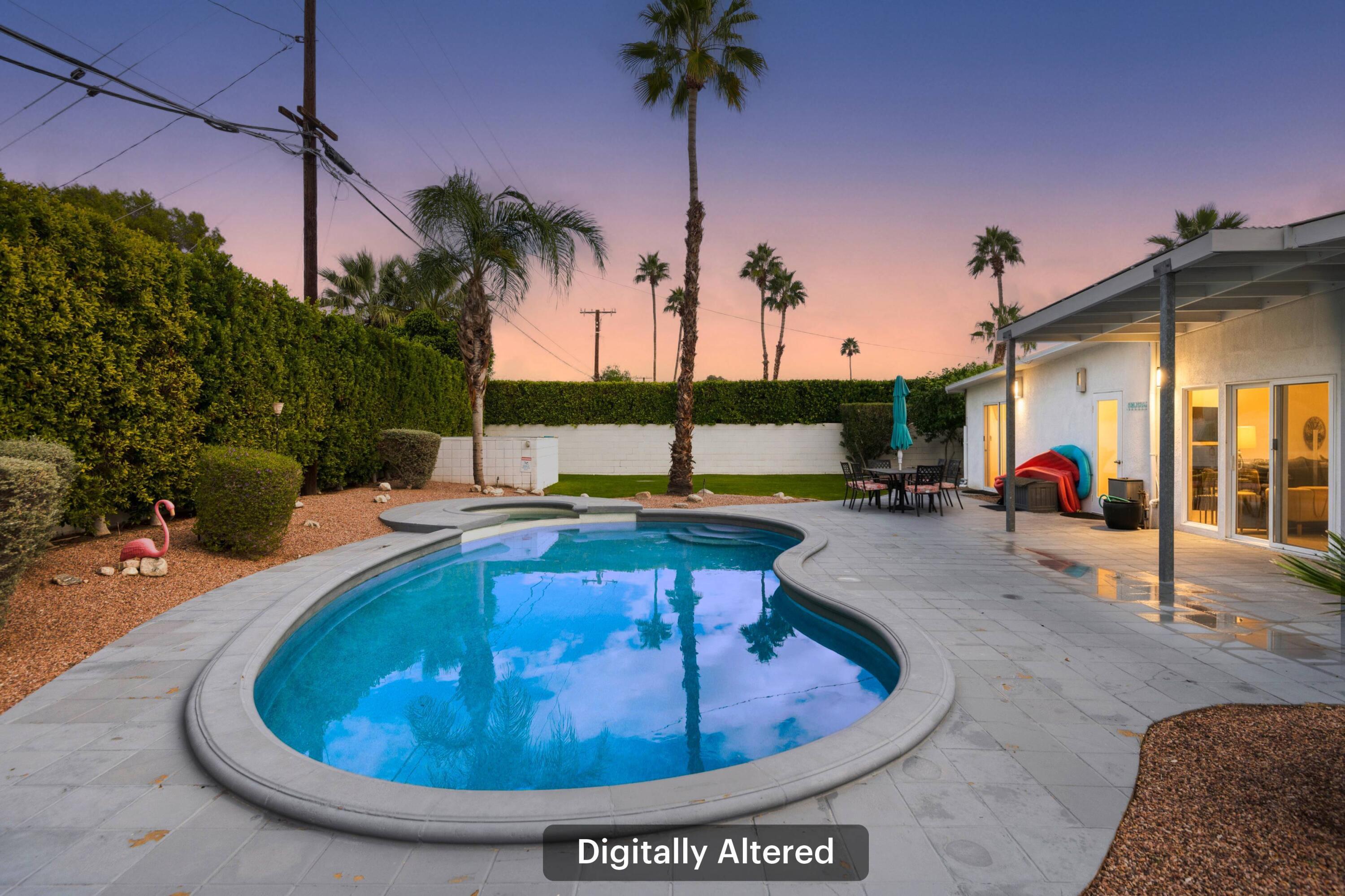 302 East Racquet Club Road Palm Springs, CA 92262 - Photo 28 of 38 a view of a swimming pool with a patio