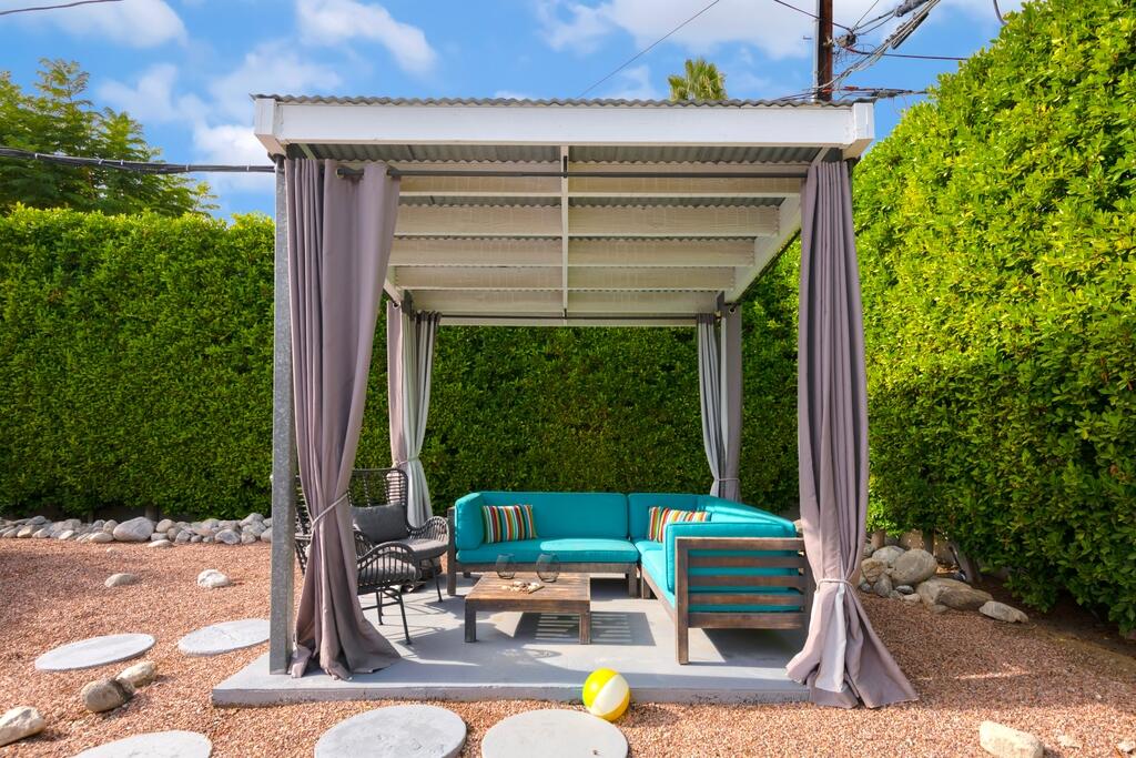 302 East Racquet Club Road Palm Springs, CA 92262 - Photo 32 of 38 front view of house with a yard