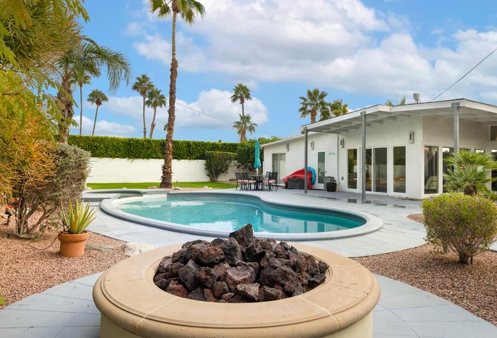 302 East Racquet Club Road Palm Springs, CA 92262 - Photo 35 of 38 a view of a house with swimming pool and sitting area