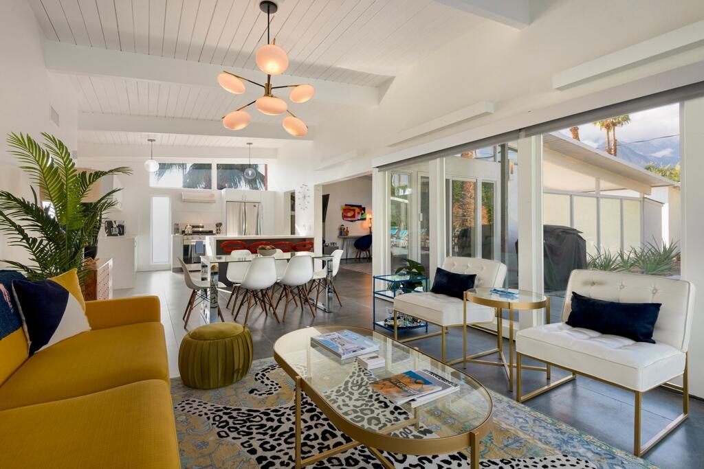 302 East Racquet Club Road Palm Springs, CA 92262 - Photo 9 of 38 a living room with furniture and a large window
