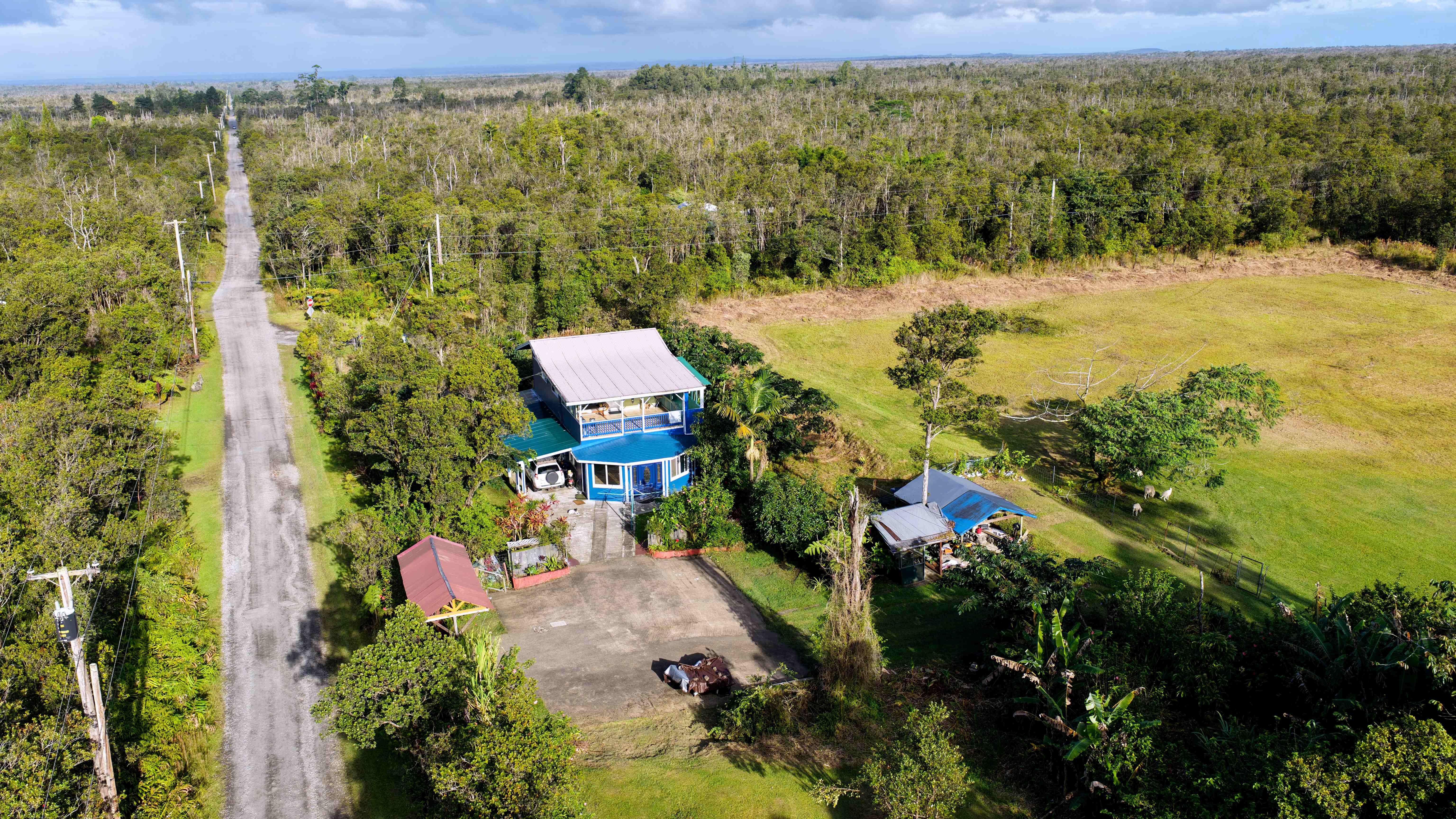 11-2477 Kokokahi Mountain View, HI 96771 - Photo 1 of 30 a view of a city with lush green forest