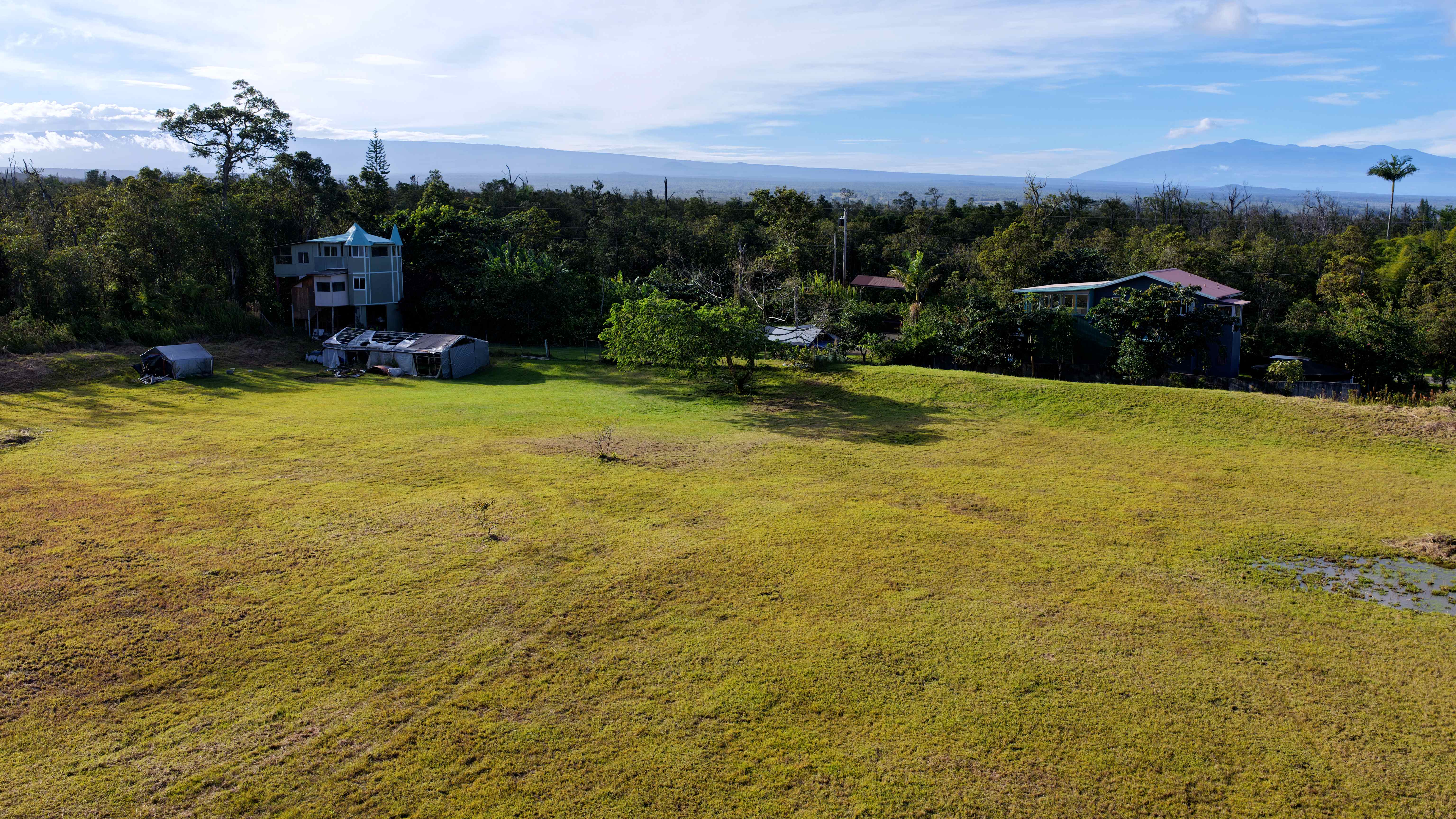 11-2477 Kokokahi Mountain View, HI 96771 - Photo 18 of 30 a view of a lake with houses