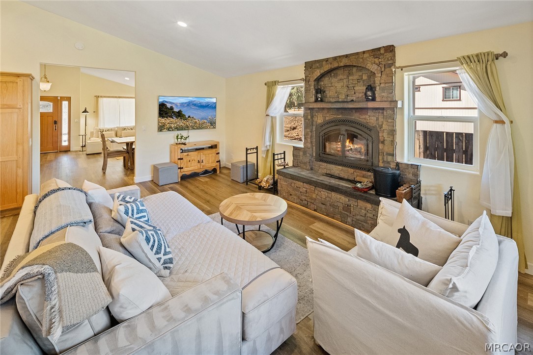 435 Wagon Wheel Road Big Bear City, CA 92314 - Photo 16 of 50 a living room with furniture and a fireplace