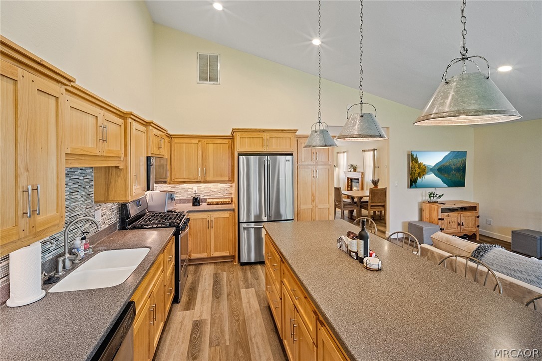 435 Wagon Wheel Road Big Bear City, CA 92314 - Photo 20 of 50 a kitchen with sink refrigerator and large window