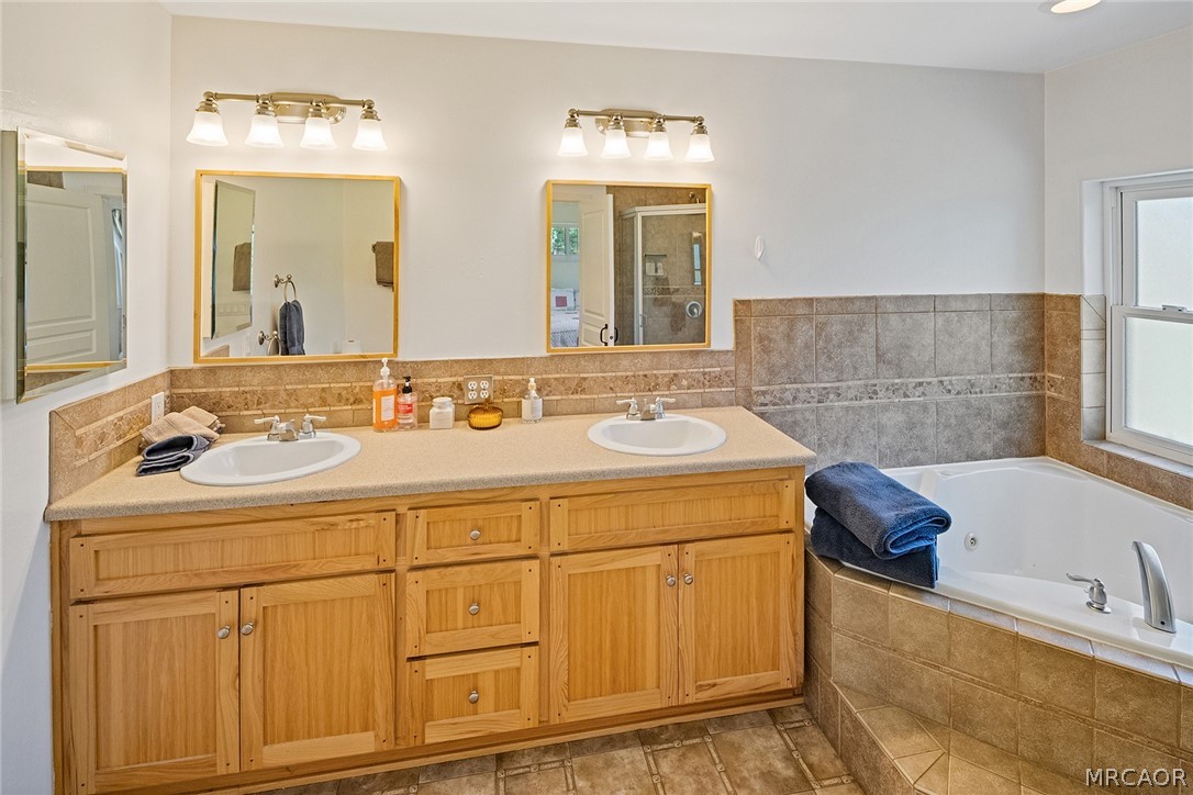 435 Wagon Wheel Road Big Bear City, CA 92314 - Photo 29 of 50 a bathroom with a sink and a mirror