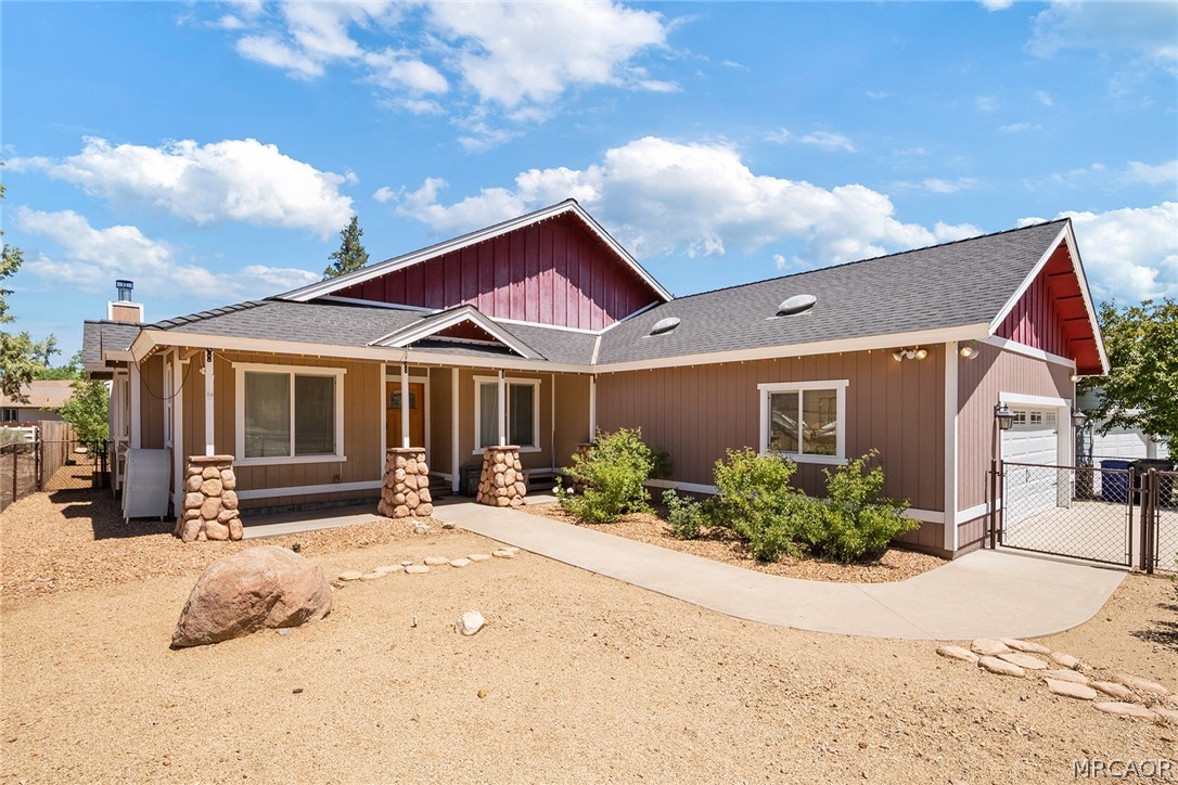 435 Wagon Wheel Road Big Bear City, CA 92314 - Photo 3 of 50 a front view of a house with a yard and outdoor seating