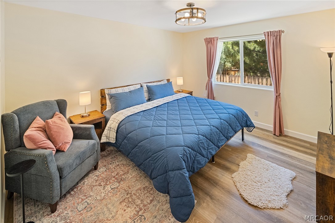 435 Wagon Wheel Road Big Bear City, CA 92314 - Photo 31 of 50 a bedroom with a bed and window