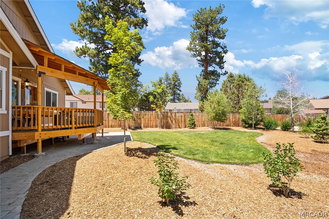 435 Wagon Wheel Road Big Bear City, CA 92314 - Photo 45 of 50 a backyard of a house with a garden and outdoor seating