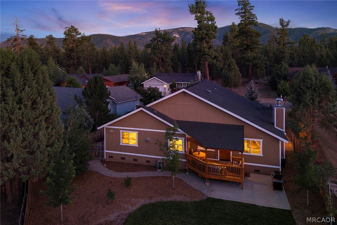 435 Wagon Wheel Road Big Bear City, CA 92314 - Photo 50 of 50 a view of a house with a yard and a sitting area