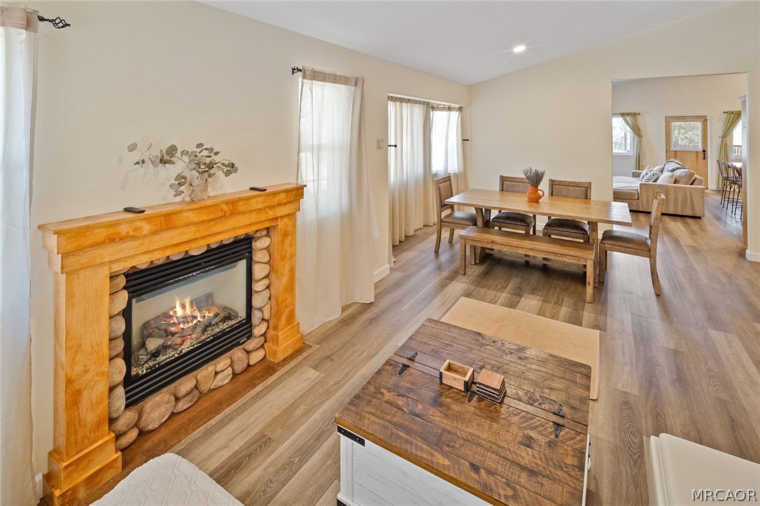 435 Wagon Wheel Road Big Bear City, CA 92314 - Photo 9 of 50 a living room with furniture and a fireplace