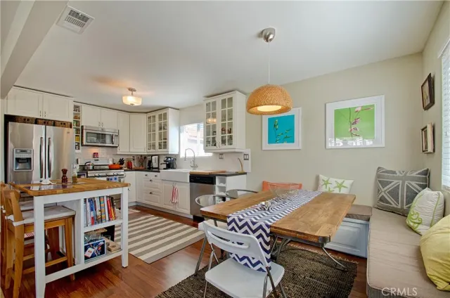 a view of a dining room with furniture and window