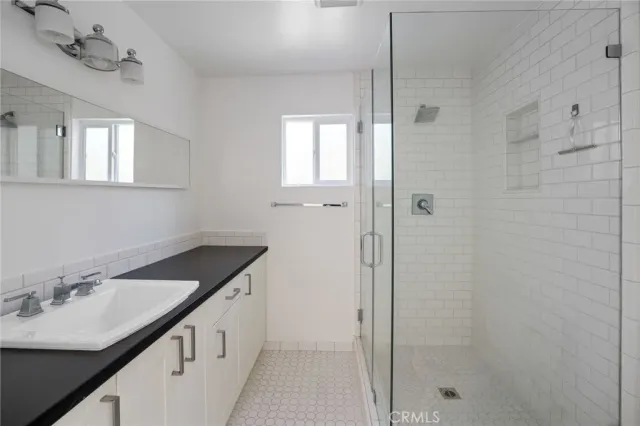 an empty room with wooden floor and closet