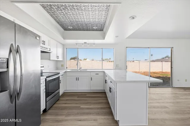 a kitchen with a sink stove and refrigerator