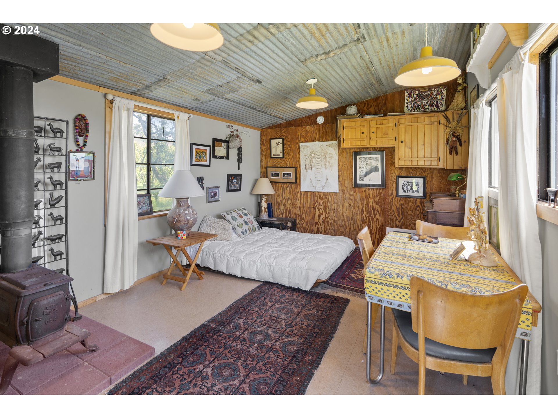 43479 Old Foothill Road Richland, OR 97870 - Photo 23 of 44 a living room with furniture a table and a chandelier