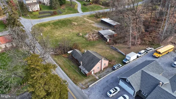 an aerial view of a house with a yard
