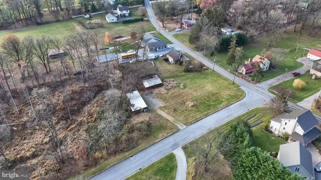 a view of swimming pool with a yard and plants