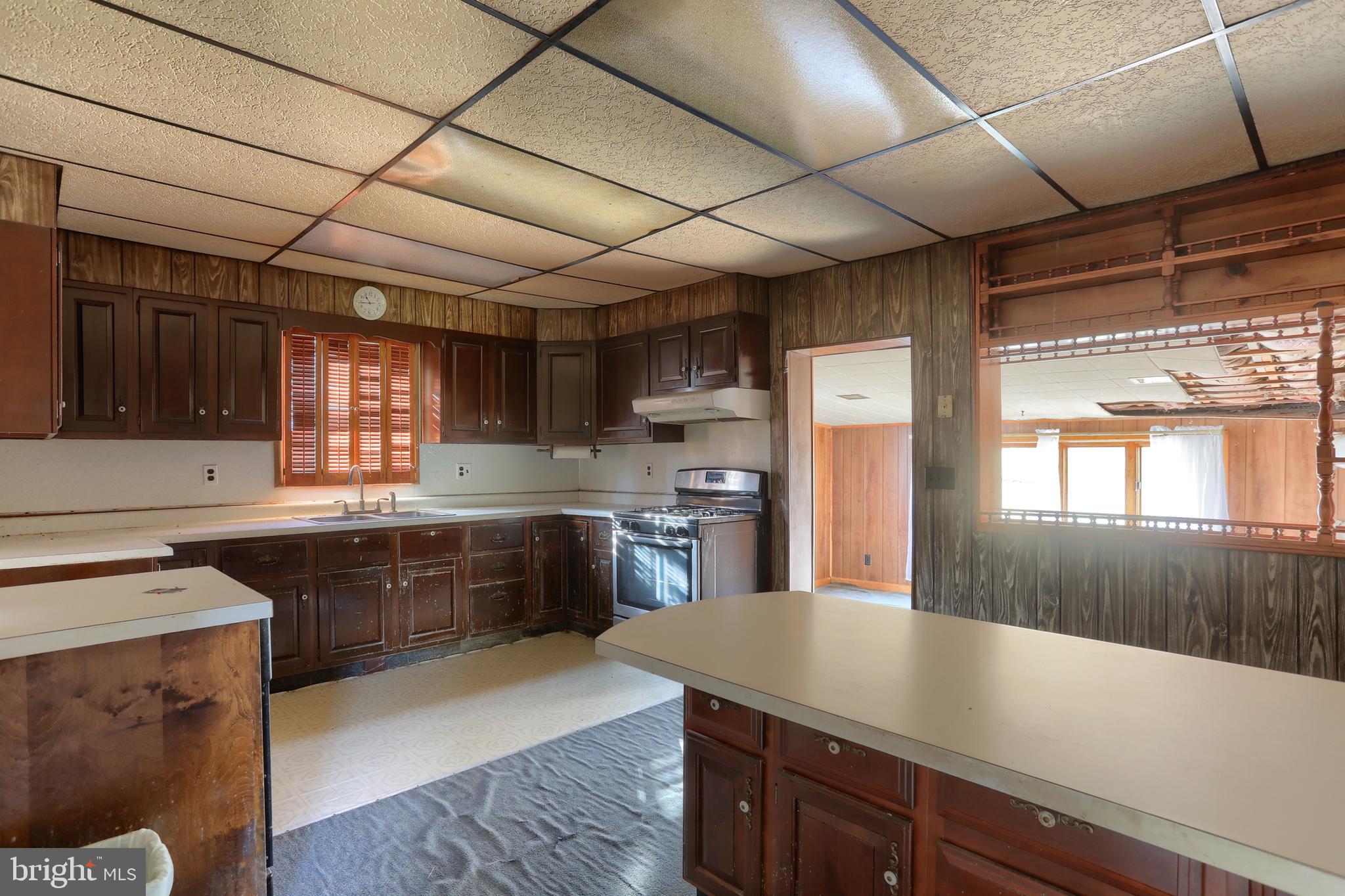 433 Sheep Hill Road Newmanstown, PA 17073 - Photo 20 of 35 a kitchen with a sink and wooden cabinets