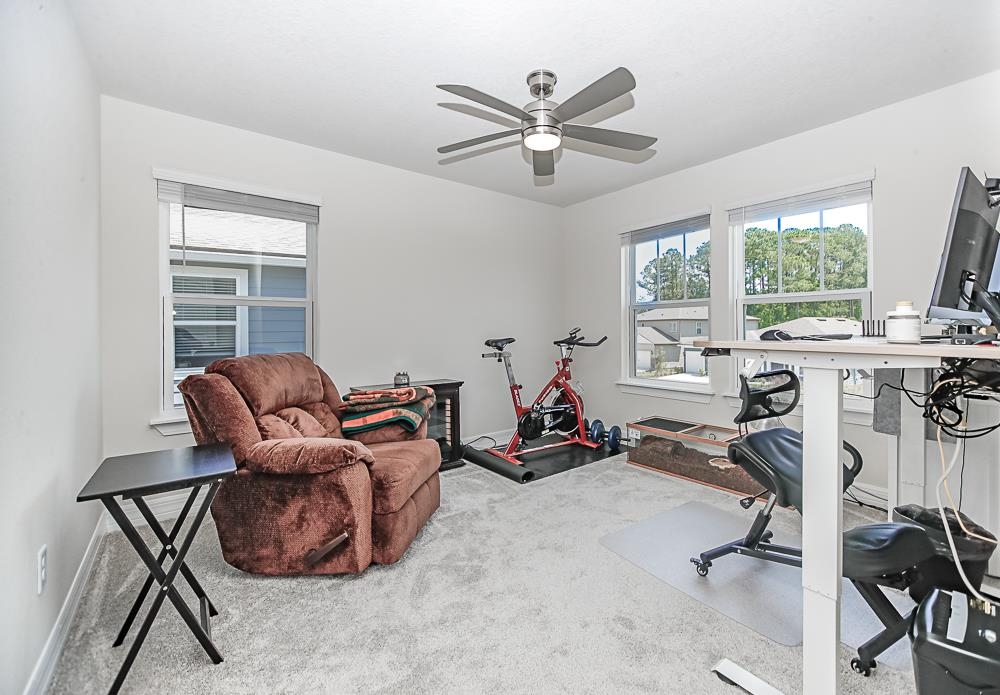 233 Red Barn Road St. Augustine, FL 32092 - Photo 11 of 40 a room with gym equipment and a large window