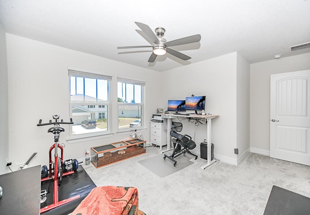 233 Red Barn Road St. Augustine, FL 32092 - Photo 12 of 40 a view of a workspace with furniture and a window