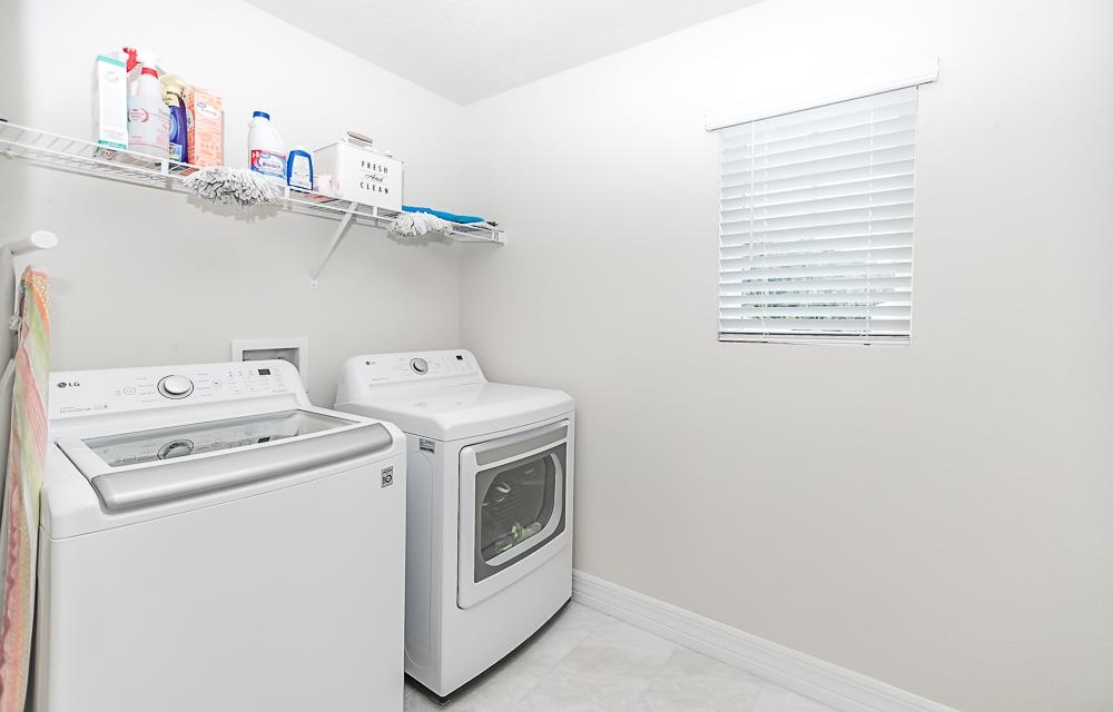 233 Red Barn Road St. Augustine, FL 32092 - Photo 13 of 40 a utility room with dryer and washer