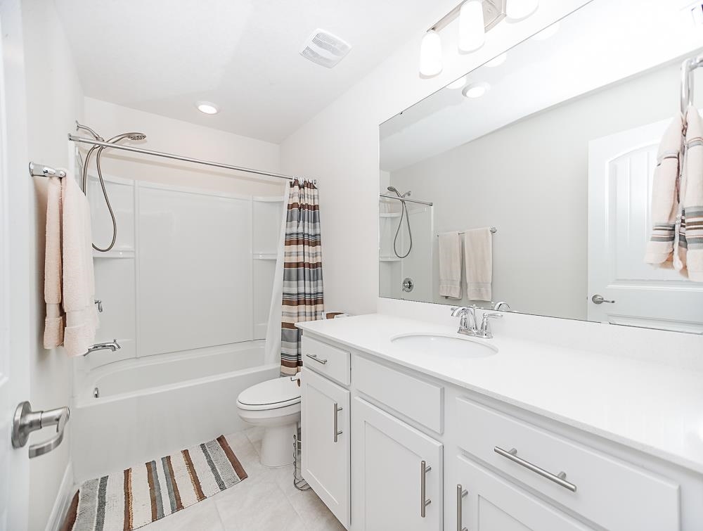 233 Red Barn Road St. Augustine, FL 32092 - Photo 14 of 40 a bathroom with a sink a toilet and shower