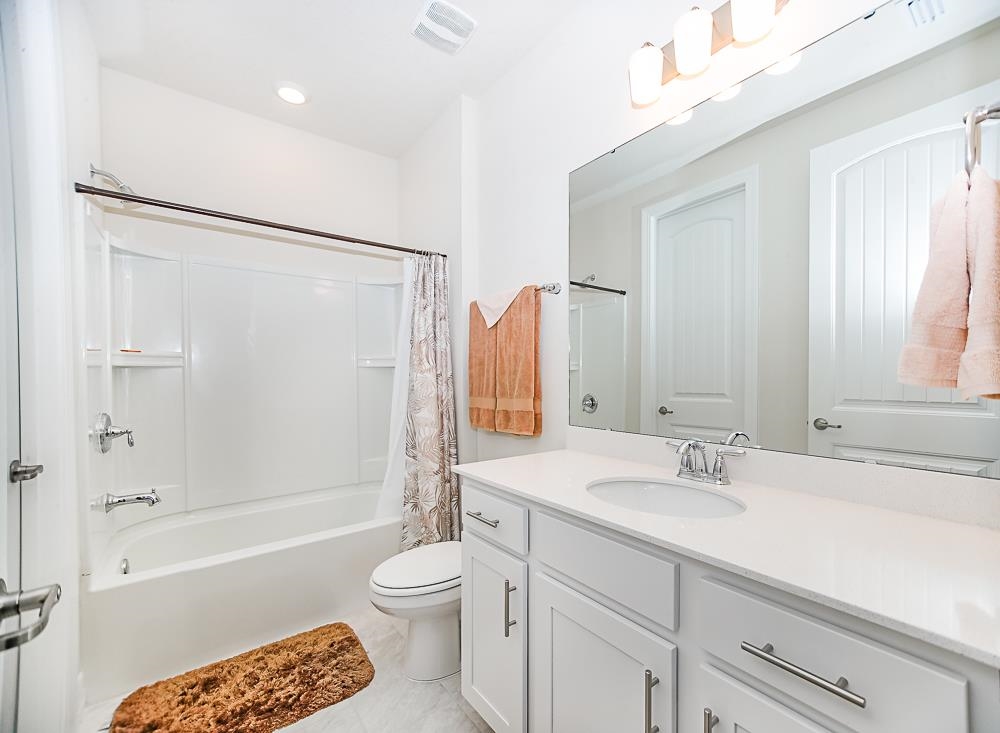 233 Red Barn Road St. Augustine, FL 32092 - Photo 19 of 40 a bathroom with a sink toilet tub and shower