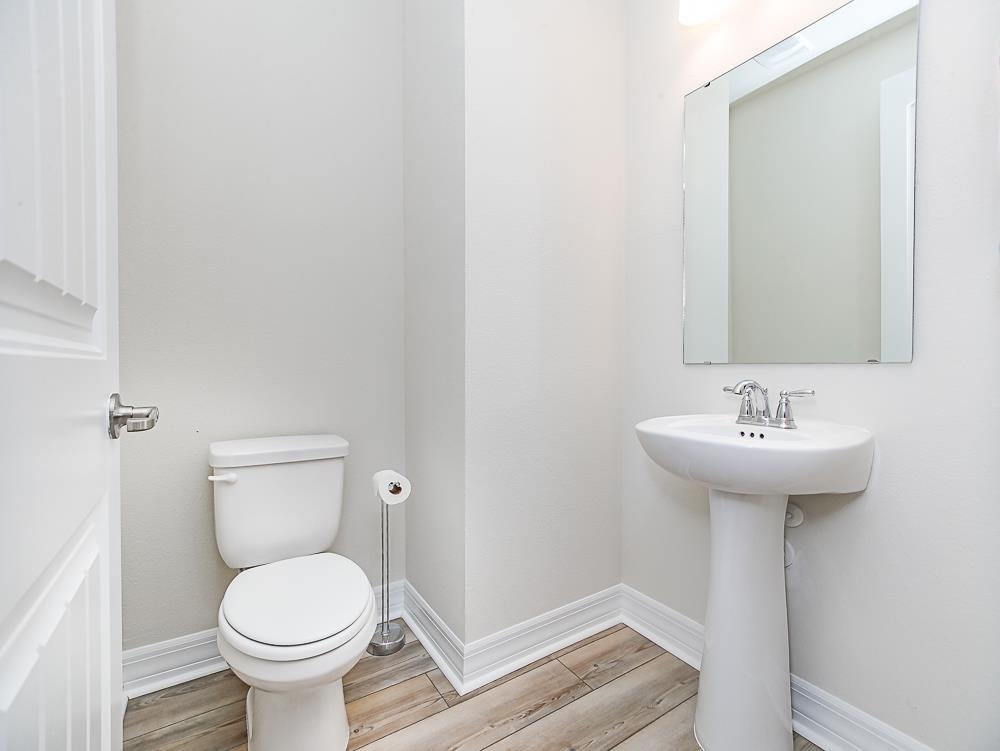 233 Red Barn Road St. Augustine, FL 32092 - Photo 20 of 40 a bathroom with a sink toilet and a mirror